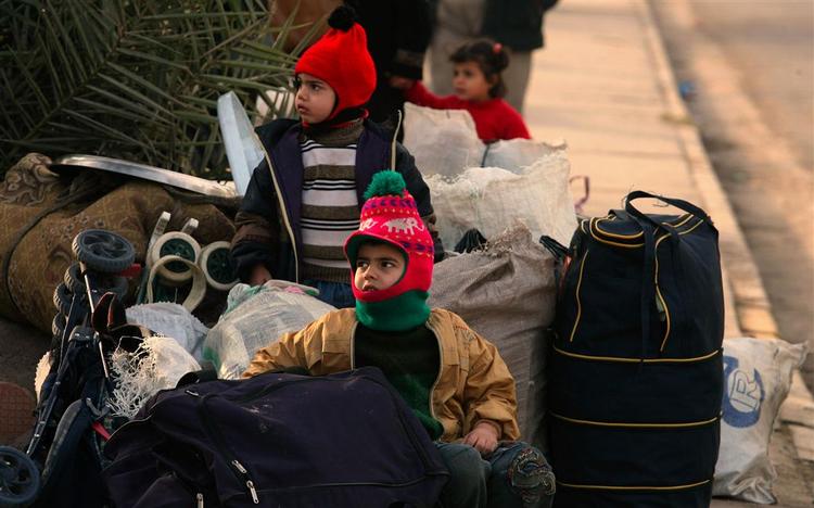 Irakiske børn hjemme i Bagdad igen, efter at forældrene forgæves forsøgte at flygte til Syrien. 