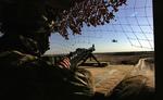 Danmark vil sende 20 instruktører ekstra til Helmand. Her er det en britisk soldat på vagt i det sydlige Afghanistan. 