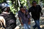 De seneste måneder har der været voldelige optøjer i flere ulande på grund af stigende fødevarepriser - som her på Haiti. 