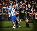 OB's Johan Absalonsen bliver fældet af FCK's Mathias Zanka i dagens SAS-Liga kamp mellem OB og FC København på Fionia Park i Odense. 