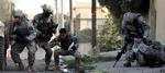 En amerikansk soldat såres under skudveksling i Mosul, nordvest for Bagdad. Soldaten blev ikke alvorligt såret, men det gjorde flere kolleger. Derfor vil et program fokusere på at genskabe ører, muskler og kropsdele. Arkivfoto. 
