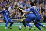 Cardiff nåede til FA Cup-finalen i sidste måned, men tabte til Portsmouth. Portsmouth-spillerne - her fire styks - blev dog sat på arbejde af den måske  kommende Manchester United-spiller Aaron Ramsey. 