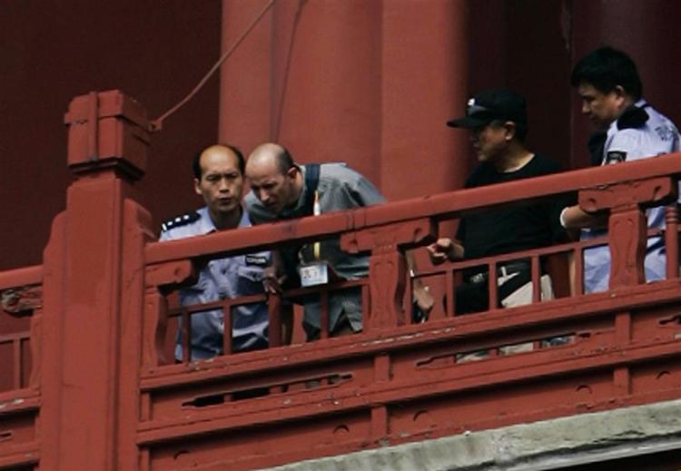 Morderen Tang Yongming kastede sig i døden fra 'The Drumtower' i Beijing. 