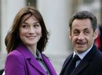 Carla Bruni i selskab med sin mand, den franske præsident Sarkozy. 