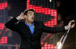 Robbie Williams og 59 andre musikere vil have pladeselskaberne til at lytte. De kræver retten til deres egen musik. Her ses mr. Williams, da han optrådte i Parken i 2006. (Arkivfoto) 