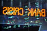 Dow Jones-indekset reflekteret på vinduet på Nasdaq lige før handlen blev ringet af i går. 