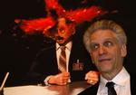 David Cronenberg foran et stillbillede fra hans nye film, 'Scanners'. Fotoet er taget forleden under en filmfestival i Rom. 