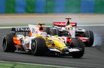Spain's Fernando Alonso, left, driving an ING Renault, left, drives side by side with Britain's Lewis Hamilton, in a McLaren Mercedes during the French Formula One Grand Prix, at the Magny Cours racetrack, central France, Sunday June 22, 2008. ING is slashing millions from its Formula One programme. 