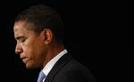 Den kommende præsident Obama puster ud i en pause under en pressekonference i Chicago i fredags. 