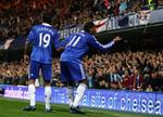Didier Drogba kaster mønten tilbage til Burnleys tilhængere og sender samtidig en fingerhilsen. 