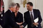 Eric Holder, som tjente under Bill Clinton, er favorit til at blive USAs første sorte justitsminister. Kvinden i billedet er den tidligere justitsminister Janet Reno. 