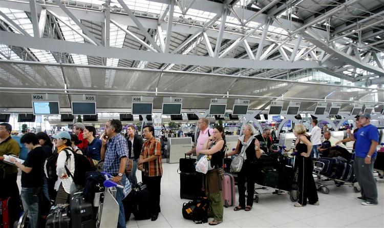 Stranded travellers in the departure lounge at Suvarnabhumi international airport in Thailand. 