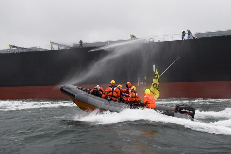 Greenpeace yesterday attempting to stop a coal cargo vessel 