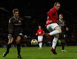 Kasper Risgård og Wayne Rooney under 2-2 kampen på Old Trafford. 