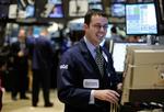 Rentenedsættelsen blev modtaget med glæde i Wall Street. Her er det børshandler Neil Gallagher, der får maseret smilerynkerne. 