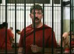 Den russiske våbenhandler Viktor Bout bag tremmer i Bangkok før dagens retsmøde. 