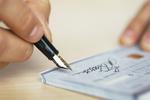 RF - Person signing check