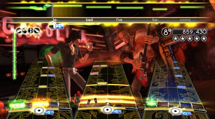 Trommeslageren i midten omkranset af bas og guitar, mens sangeren ligger foroven. Sådan spiller man covernumre i 'Rock Band 2', hvis brugerflade er en af fordelene over rivalen 'Guitar Hero World Tour' 