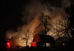 Billede fra Clarence Center ved Buffalo i staten New York efter flystyrtet. 12 huse blev beskadiget af flammerne efter styrtet. 