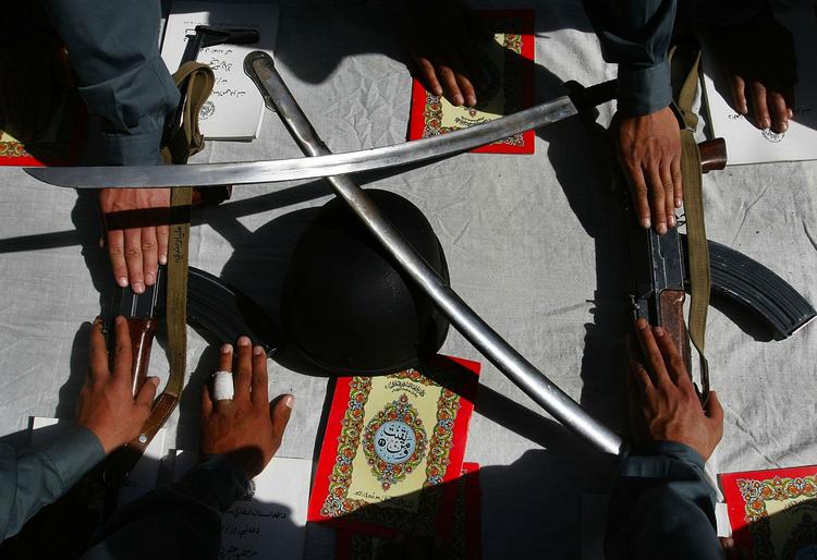 Afghan police officers taking the oath at a ceremony at the Police Academy in Kabul. The EU has promised 400 officers to help with training and support, but so far can only muster 193. Archive photo. 