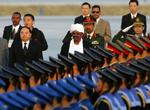 Kina har nære forbindelser med Sudan. Billedet er fra 2006, hvor Sudans præsident, Bashir, blev modtaget med pomp og pragt i Bejing. 