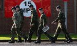 Sikkerhedsprocedurerne på Massereene British Army Base i Antrim er blevet optrappet, efter to af kasernens soldater blev dræbt i lørdags. 