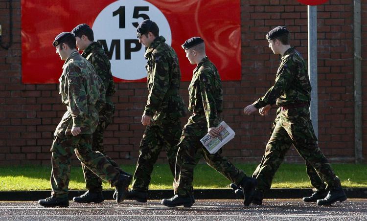 Sikkerhedsprocedurerne på Massereene British Army Base i Antrim er blevet optrappet, efter to af kasernens soldater blev dræbt i lørdags. 