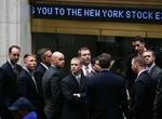 Aktiehandlere fotograferet på børsen i New York i går. I dag var der anderledes grund til smil. 