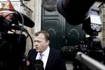 Lars Løkke Rasmussen emerging from the royal palace as Denmark's new prime minister. 