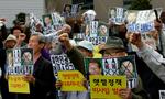 Sydkoreanske aktivister i Seul i dag  protesterer mod Nordkoreas raketaffyring. 