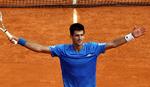 Novak Djokovic var træt med glad, da efter en langvarig dyst mod Stanislas Wawrinka havde skaffet sig billet til finalen i Monte-Carlo. 