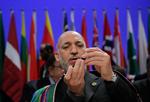 Hamid Karzai er ikke mindst blevet kritiseret for at have skrevet under på en lov, som blandt andet giver ægtemænd ret til sex hver fjerde dag. (Arkivfoto) 