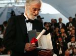 Palmevinder Michael Haneke ved prisceremonien i festivalpalæet søndag aften. 