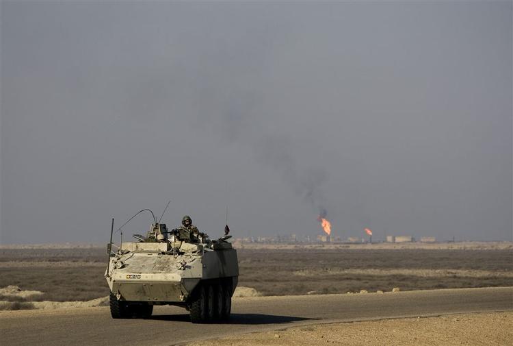 De tre danske soldater, som blev såret ved en vejsidebombe i går, kørte i en sådan pansret piranha-mandskabsvogn. Denne er fotograferet under Irakkrigen. (Arkivfoto) 