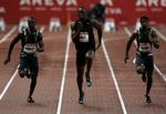 Usain Bolt (i midten) løb 100 meter på 9,77 sekunder og slog blandt andet Yohan Blake (th.) og Daniel Bailey. 