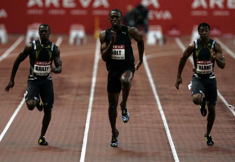 Usain Bolt (i midten) løb 100 meter på 9,77 sekunder og slog blandt andet Yohan Blake (th.) og Daniel Bailey. 