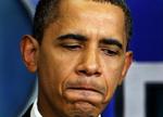 Barack Obama i en kort tænkepause under fredagens møde med pressen i Det Hvide Hus. 
