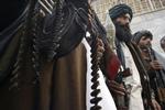 Tidligere Taleban-krigere afleverede deres våben ved en ceremoni i Herat i marts. 