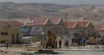 Palæstinensiske arbejdere i fuld gang med at udvide den jødiske bosættelse Maaleh Adumim på Vestbredden. 