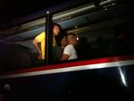 De udviste irakere føres bort fra Brorsons Kirke i en bus. Mobilfoto. 