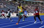 Jamaicas Usain Bolt (midt) tog det roligt i de indledende runder på spinterdistancerne ved VM i Berlin. 