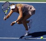 Caroline Wozniacki gjorde kort proces, da hun slog Petra Martic i anden runde af US Open, og det vækker tilfredshed hos hendes far. 