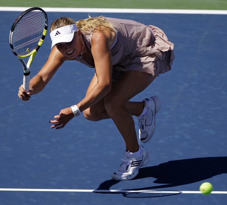 Caroline Wozniacki gjorde kort proces, da hun slog Petra Martic i anden runde af US Open, og det vækker tilfredshed hos hendes far. 