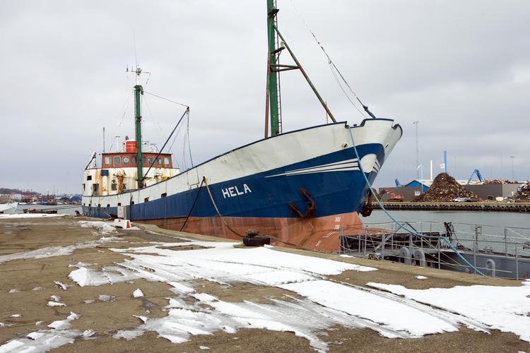 Smuglerskibet 'Hela' lå i Frederikshavn i 2006, før det blev sendt til ophugning. Med anholdelsen af den sidste eftersøgte dansker sættes et endeligt punktum i sagen om smuglerbåden 'Hela'. 
