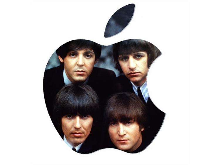 Paul MCCartney siger, at det er pladeselskabet, der har forsinket muligheden for at downloade Beatlessange digitalt. Men nu er der fundet en løsning, siger han. Betyder det, at hele bagkataloget kommer på iTunes i dag? Det er der mange, der tror.Fotocollage - Originalfoto AP/Robert Freeman 