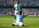 Emmanuel Adebayor fik scoret mod sin tidligere klub Arsenal, da Manchester City slog London-klubben med 4-2. 