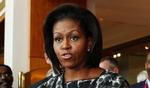 Journalisterne flokkes om Michelle Obama. Hun er »spændt« på besøget i København. 
