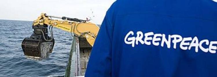 Greenpeace has begun dumping 3-ton granite blocks into the Kattegat. 