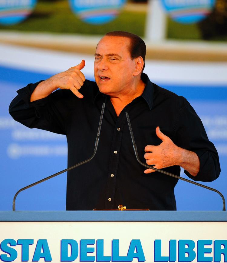 Silvio Berlusconi er ifølge ham selv en rigtig god ven, der er god til at fortælle vittigheder, men jobbet som Italiens premierminister er ikke altid hans kop te. Arkivfoto. 