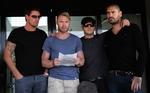 De fire andre tidligere Boyzone-medlemmer samlet i Mallorca lufthavn, hvor Stephen Gately døde i en ferielejlighed sidste lørdag. 